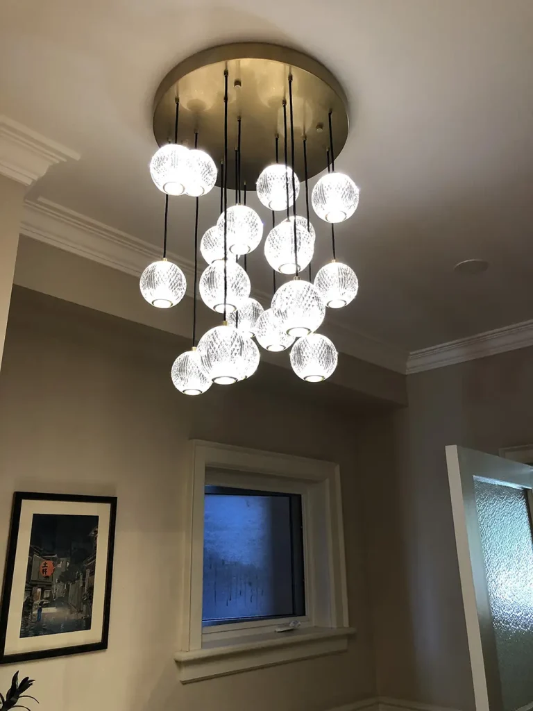 Multi-globe glass chandelier installed in a traditional home