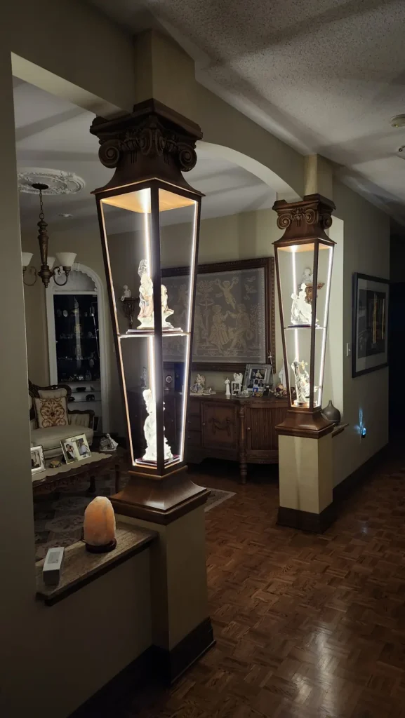 Antique display columns retrofitted with concealed LED strip lighting