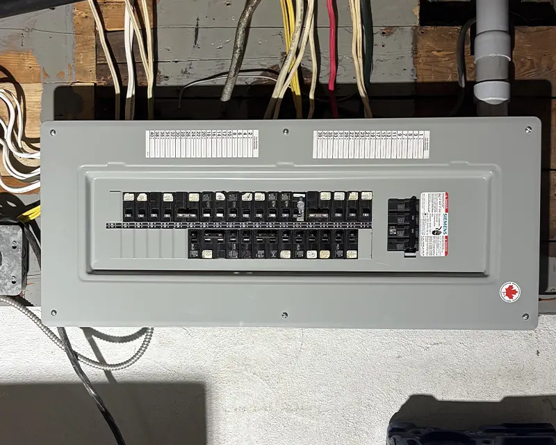 Completed breaker panel with neatly arranged circuits after a service upgrade