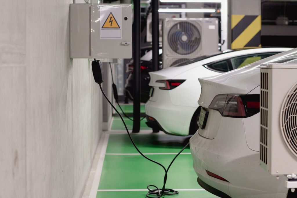 Electric vehicles charging from wall-mounted equipment in an underground parking garage