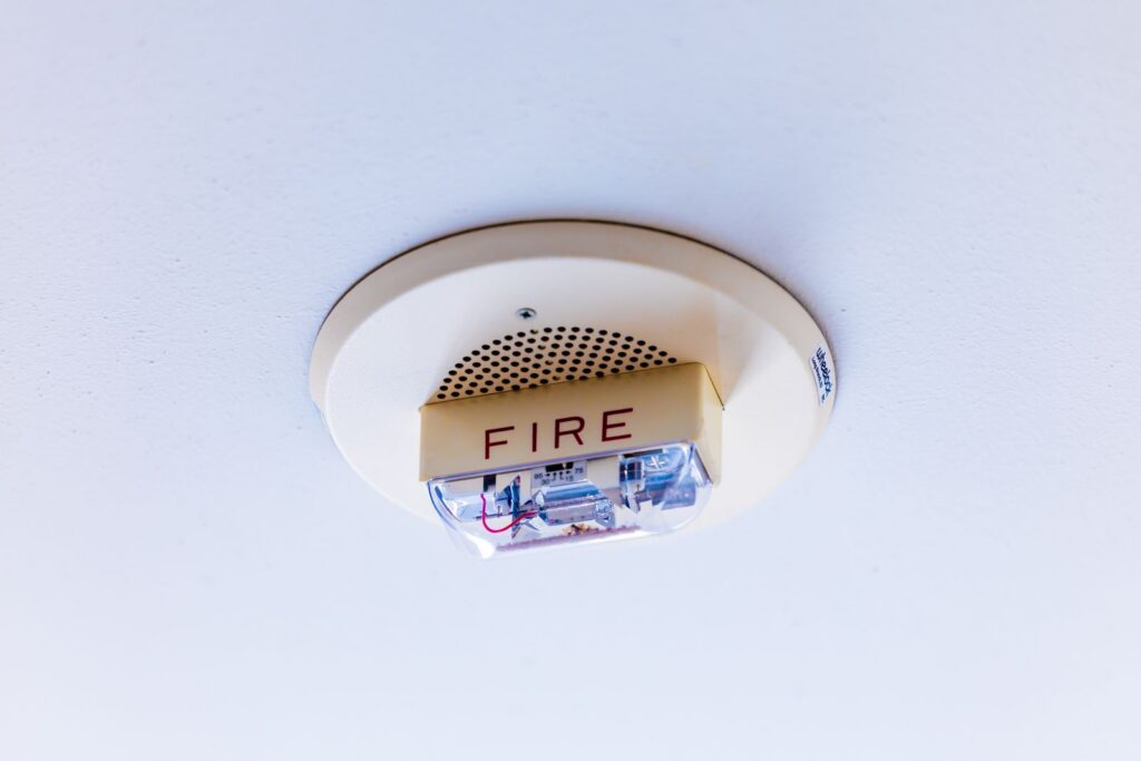 Ceiling-mounted smoke and fire alarm in a home